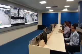 Police monitoring criminal activities with CCTV camera