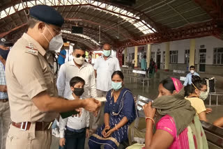 RPF distribute masks to passengers on railway platform in Delhi cant