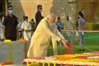 Prime Minister Narendra Modi pays tribute to Mahatma Gandhi at Raj Ghat