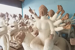 Sculptor making goddess statue