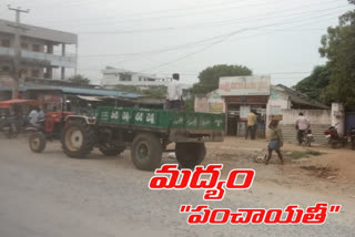 liquor supply through grama panchayath tractor in lingagiri