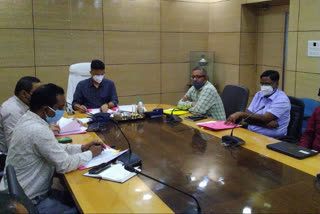 dc holds review meeting in dhanbad