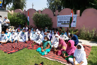 District Congress Committee staged silent sit-in protest over increasing crimes against women