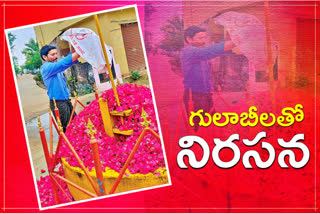 A man protests with roses at Akkampeta Bodrai, Warangal Rural District