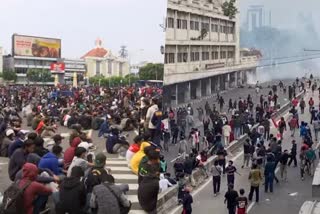 Protests against new labour law turn violent across Indonesia