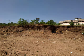 After illegal excavation around the model school, the city council built the garbage base