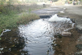 dirty water is flowing on the road