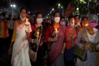 BJP workers hold a candlelight vigil in Kolkata against the state government