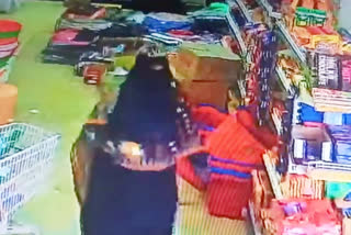 Woman in supermarket stolen essentials at asifabad