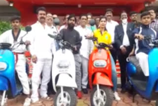 scooties distribution to the sports persons by palm springs motors in hyderabad