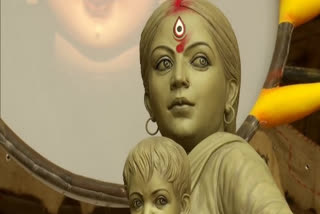 Walking back miles from big city -- Durga finally home with children