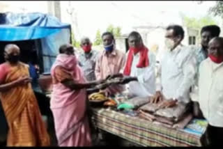 cpi leaders distributed sarees and fruites