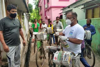 Odisha tourism minister distributing newspaper