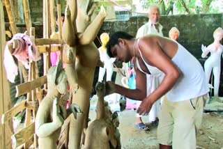 Rangapara teracotta artists making Durga murti