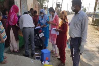 Health Department team taking corona sample in Gannaur