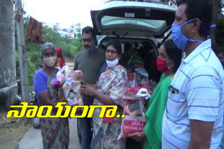 dhanalakshmi trust distributed groceries and clothes in chandanagar division