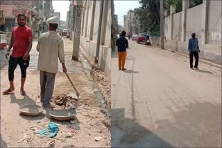 daily wages laborers cleaning drain kirari