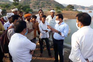 Collectors discussing with villagers