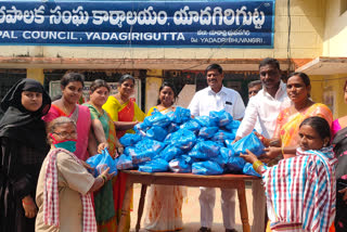 grocery distribution to snaitation workers at yadagirigutta