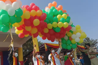 minister R Ashok hoists flag on the  occasion of 65th kannada rajyostava