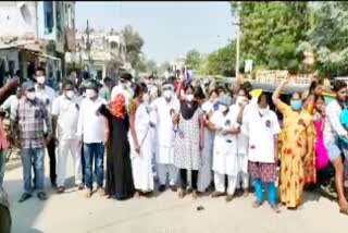 contract employees protest at huzurnagar area hospital for pending salaries