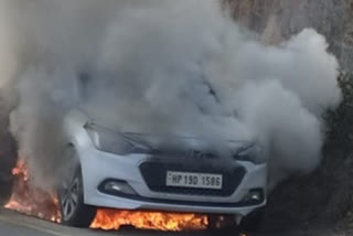 Fire in car parked on road on in Una