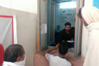 trainee distributing medicine in charkhi dadri government hospital