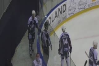 ice-hockey-player-smashes-through-rink-outer-glass-in-goal-celebration