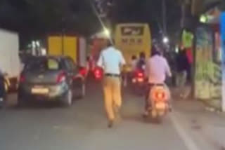 Hyderabad traffic cop runs through heavy traffic to clear way for ambulance
