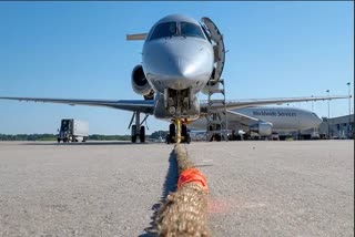 Russian strongman sets 'plane pull' national record