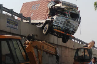 behror news, truck hanging, flyover railing