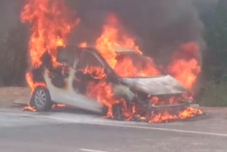 a-car-caught-fire-on-the-national-highway-near-nadiad