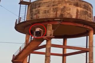 Youth troubled by disease climbed on water tank