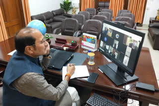 Sugarcane Minister Suresh Rana holding a review meeting through video conferencing