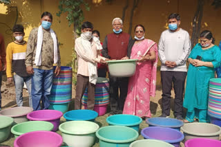 Former MP Mahabal Mishra and MLA Vinay Mishra distributed tubs to needy family on Chhath festival