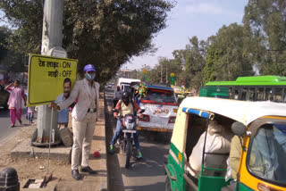 civil defiance personnel stand at red light