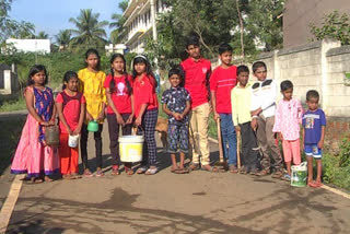 Group of 12 children care for trees planted by forest dept