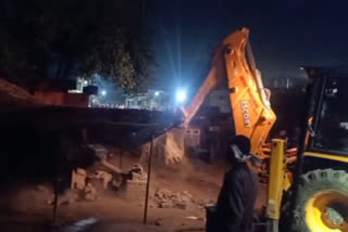 bulldozer on Illegal possession in basti