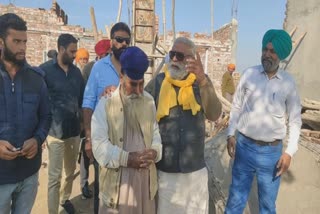 A fallen lantern of a house under construction by a farmer, Yograj Singh arrived with help