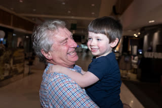 Sydney based Grandad Alan Kinkade reunites with his grandson Tom, who lives in Melbourne, after six months of separation at Sydney domestic airport at Sydney Airport on November 23, 2020 in Sydney, Australia. The New South Wales reopened its border to Victoria at 12:01 on Monday 23 November, with people able to freely travel into NSW for the first time since border restrictions were put in place in July due to Victoria's second wave COVID-19 outbreak.