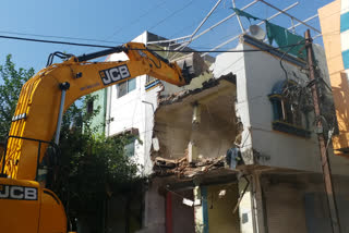 Municipal corporation bulldozer on illegal construction