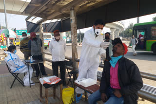 health team testing of corona at bus stop