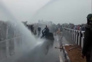 Police use water cannon to disperse farmers who have gathered in Kurukshetra to proceed to Delhi to stage a demonstration