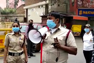 DCD workers are making people aware to avoid corona in Mehrauli market