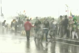 Police use water cannon and tear gas shells to disperse farmers who are gathered at Ambala against the Farm laws