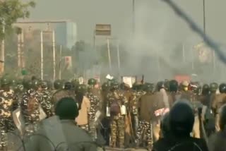 police use tear gas shells to disperse protesting farmers at singhu border