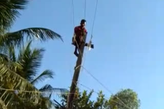 A man who climbed the power pole