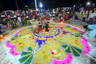 Devotees watching the Jwala Toranam at Vinayaka Ghat