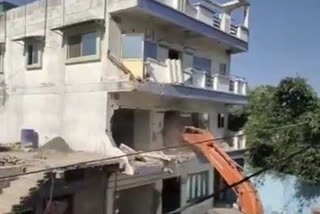 illegal house of district Badar crook Kalam has been demolished