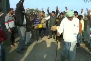 People who came from Pakistan as refugees celebrate after casting votes in District Development Council polls